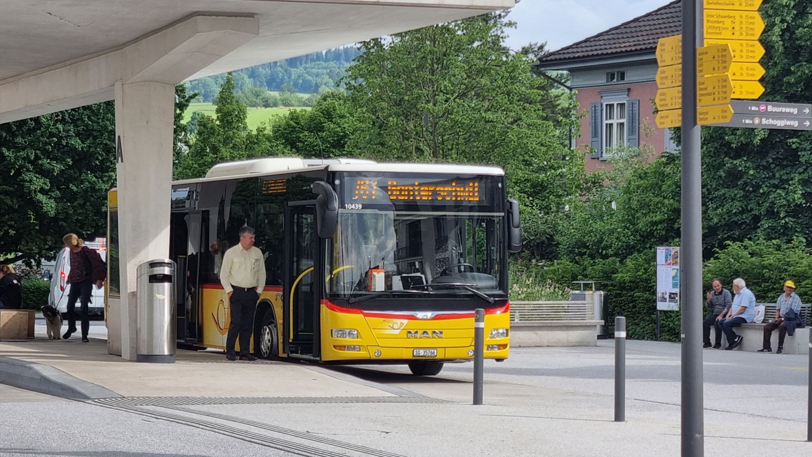 A Postbus at Flawil railway station