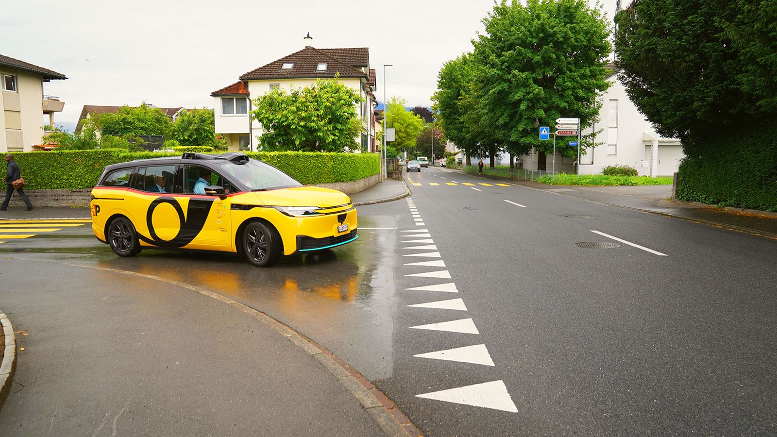 An AmiGo vehicle turning into a road