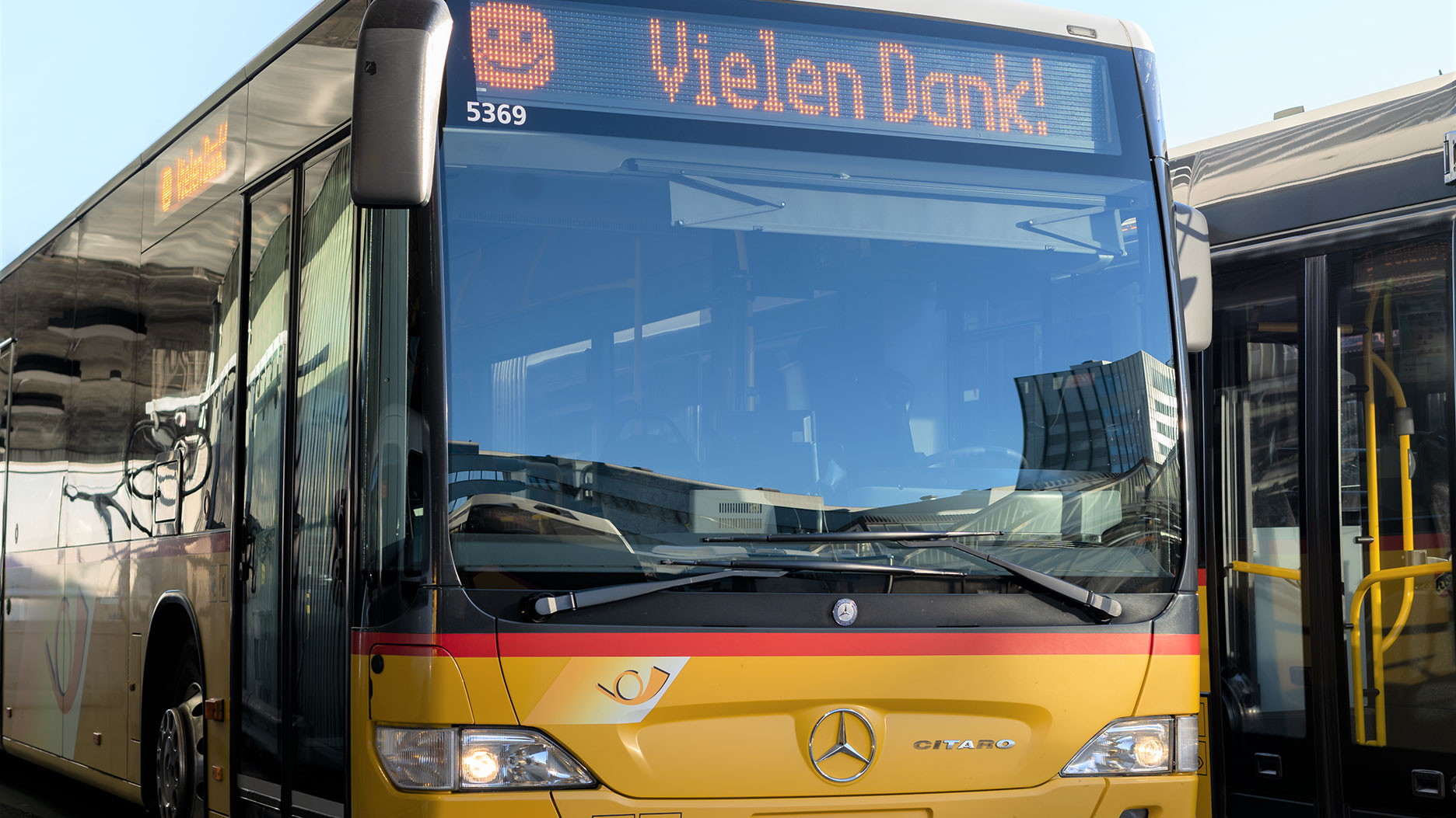 A Postbus features the text “Thank you!”